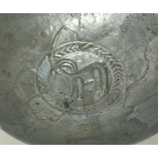 Metal dish, antelope inside sun symbol